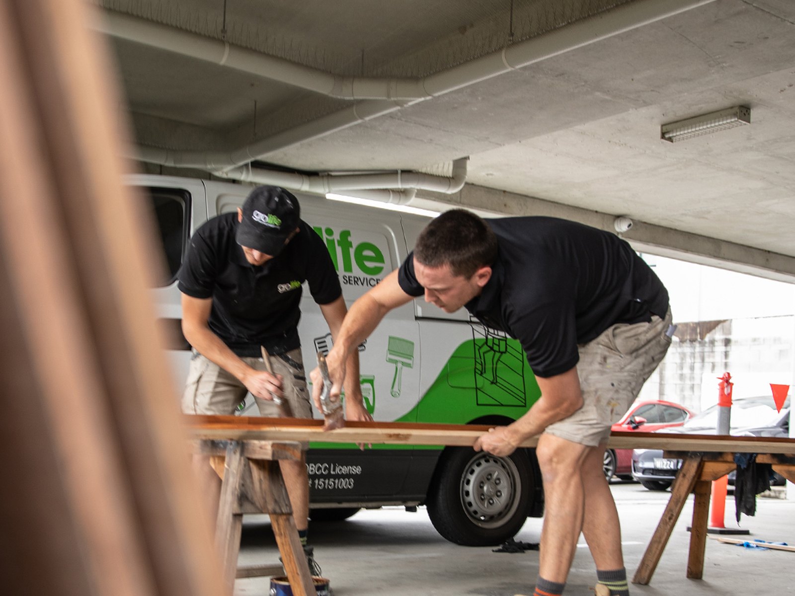 A Grolife Property Services crew working alongside a branded service van