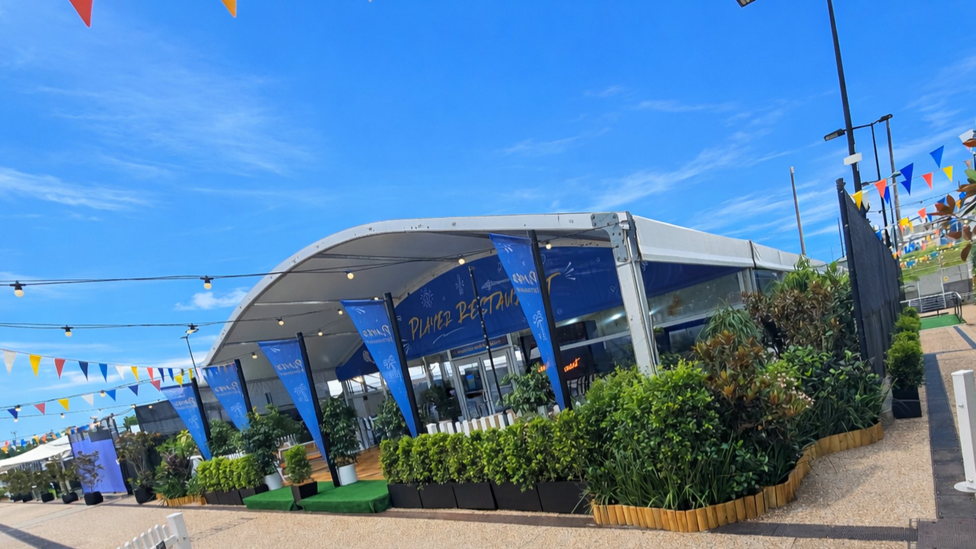 The Player Restaurant marquee at the Brisbane International tennis &mdash; dressed with Grolife planter beds and tropical foliage