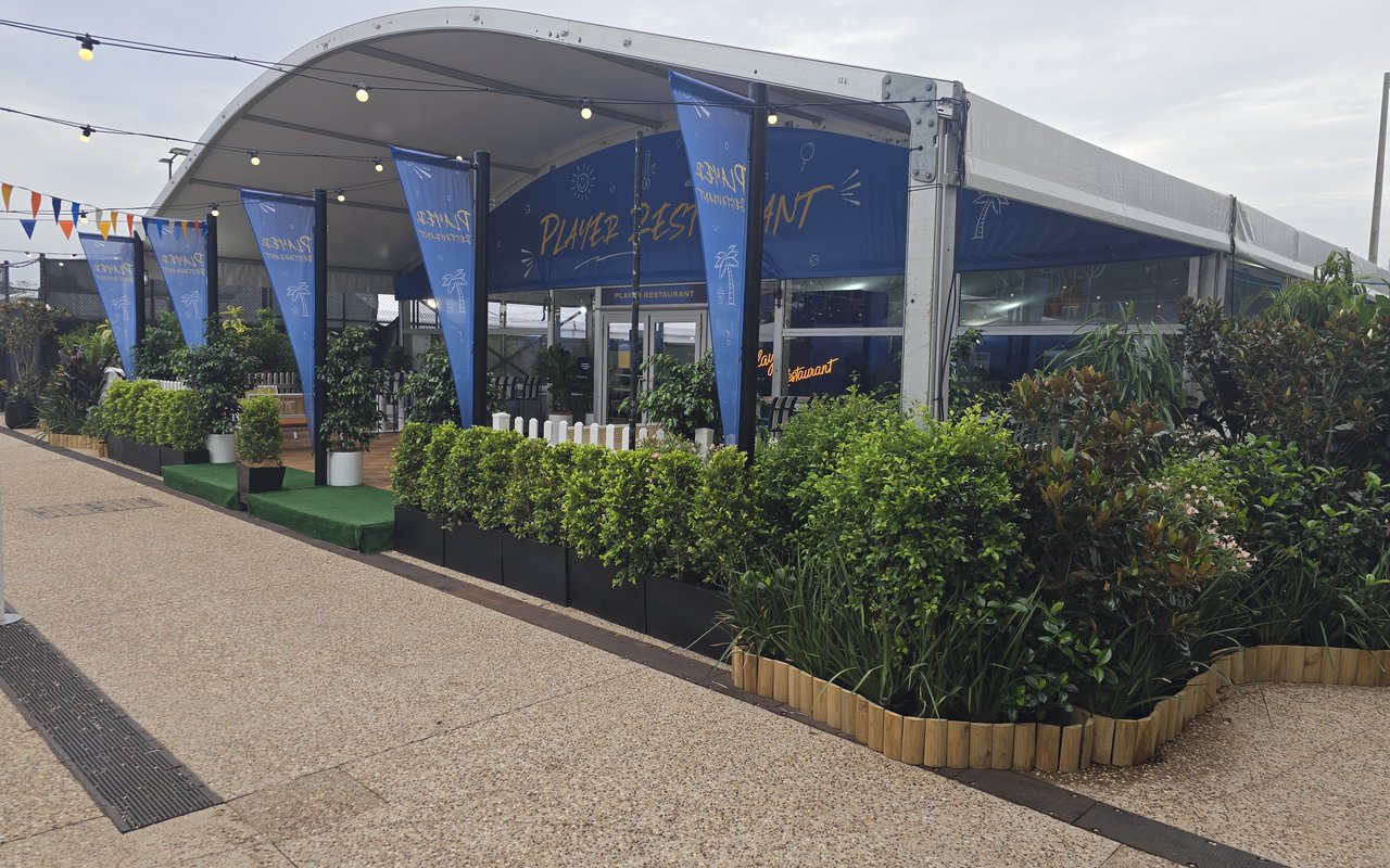 The Player Restaurant at the Brisbane International tennis tournament, styled with hedges, topiary and lush greenery by Grolife Indoor Plantscapes